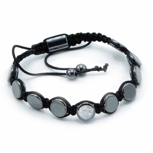 A black macrame bracelet with shiny, flat gray stones circles on a white background. A sliding knot and two gray beads adjust the bracelet’s size.