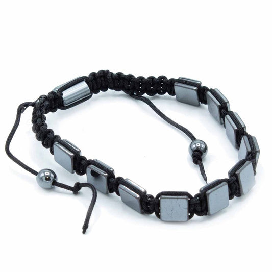 A bracelet is displayed against a white background. It has a black, woven band with square, metallic, dark gray beads and black, spherical beads on the adjustable ends.