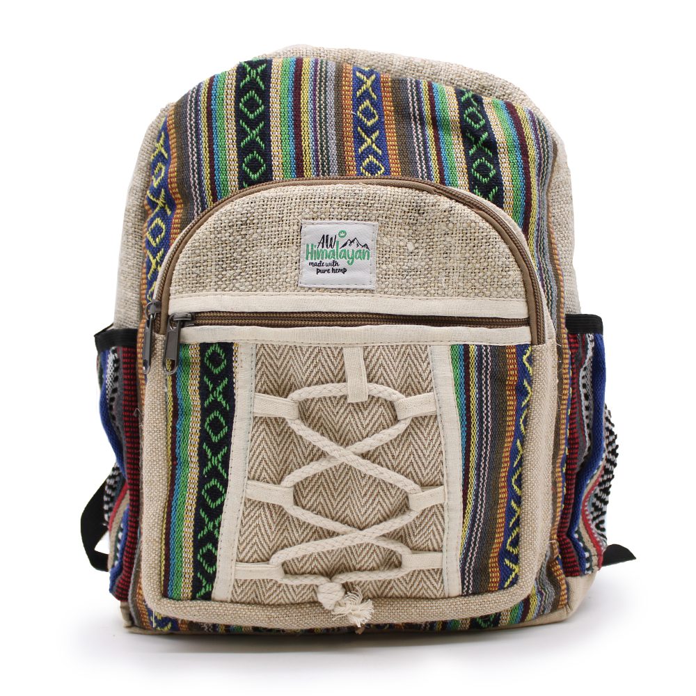 The backpack displays a colorful, striped and geometric pattern. Its front pocket includes a faux criss-cross lacing design. A tag reads: "AW Himalayan made with pure hemp". It sits on a white surface.