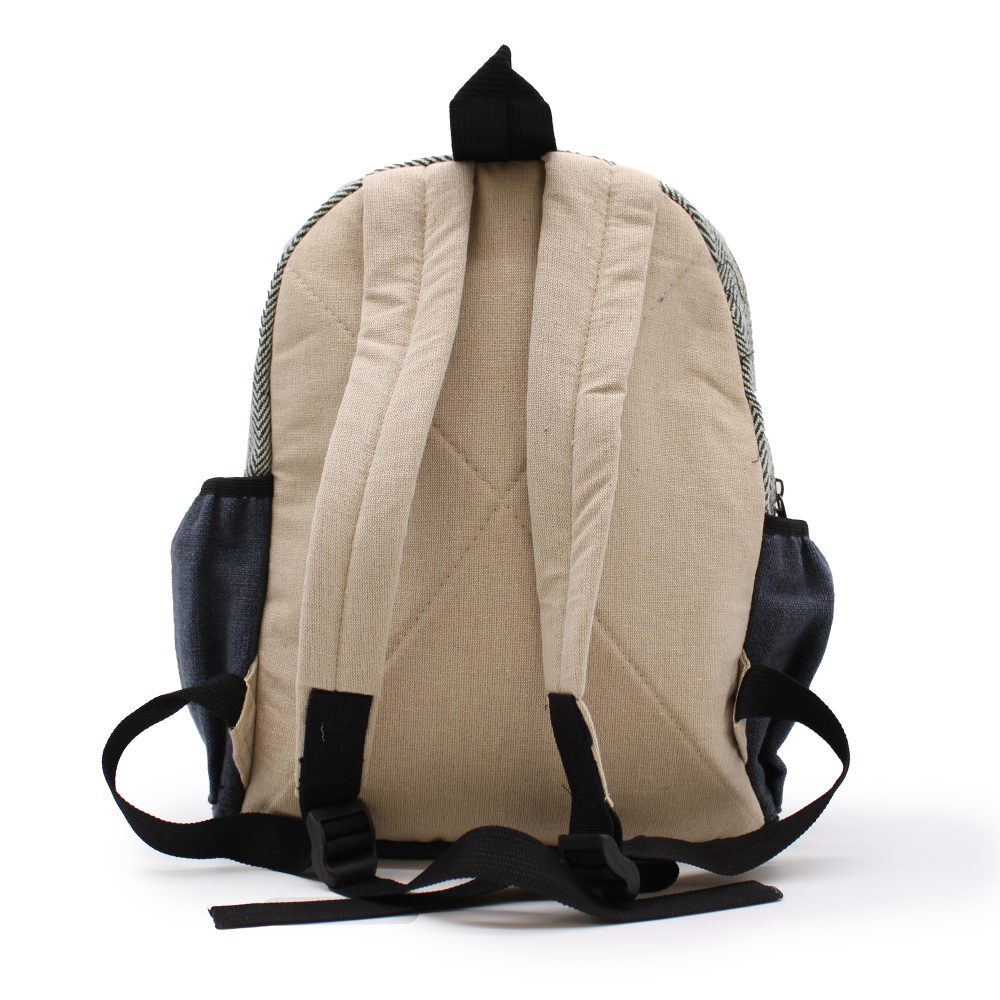 A tan and blue-grey herringbone backpack stands against a white backdrop; its back features two adjustable straps, along with black buckles, while its sides have pockets.