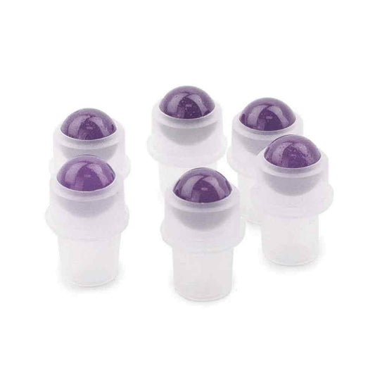 Six clear plastic roller bottles with purple gemstone roller balls stand on a white surface.