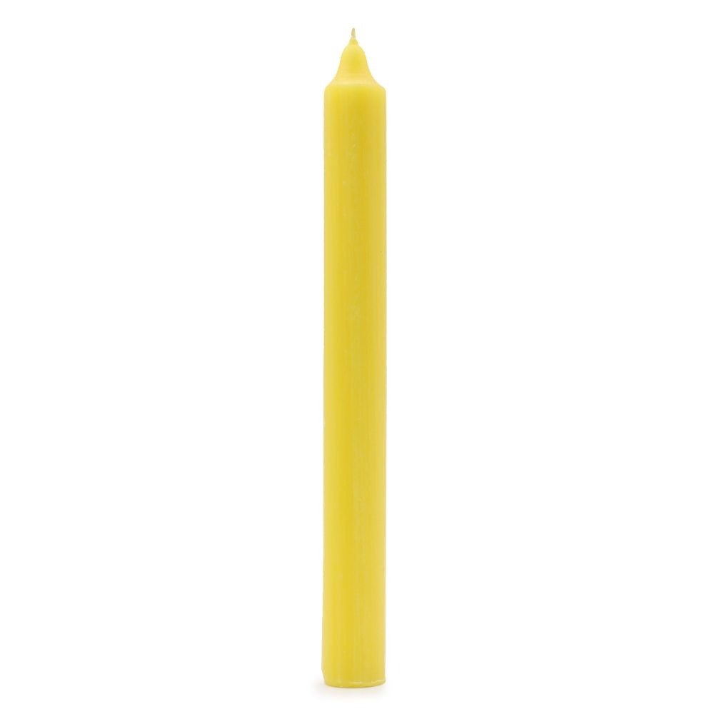 A long, slender, solid yellow candle stands unlit, centered against a bright, solid white background.