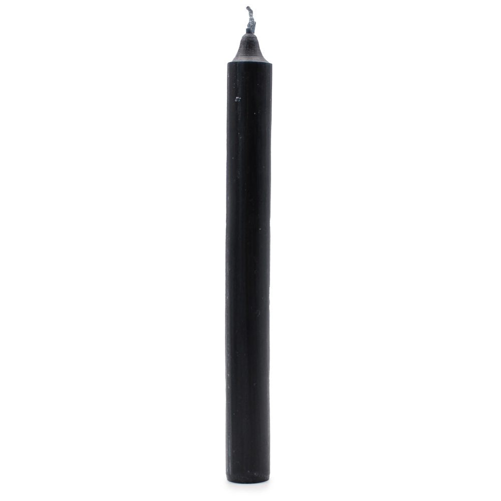 A black, unlit, cylindrical candle sits upright. It's placed against a stark white background.
