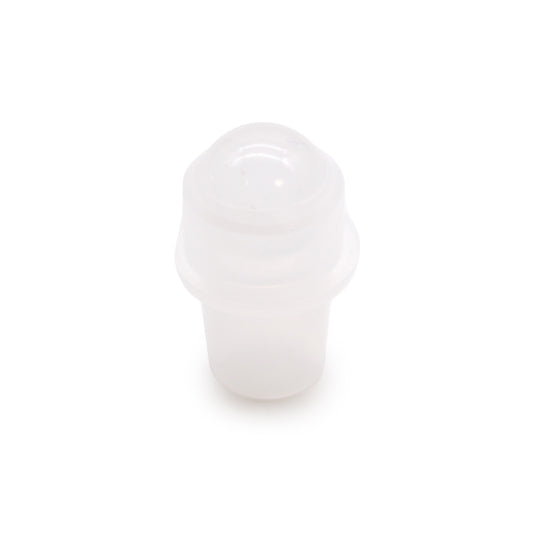 A translucent white plastic stopper sits upright on a stark white surface, catching light and casting a slight shadow.