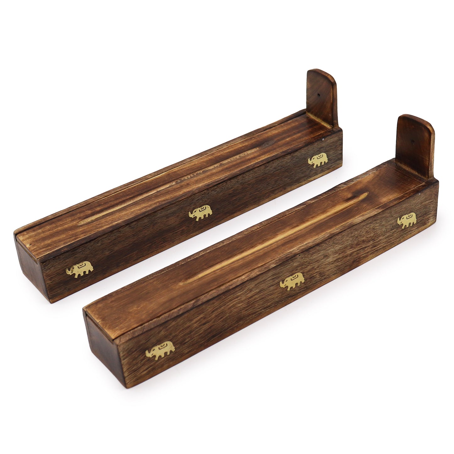 Two wooden incense holders, each adorned with small, gold elephant motifs, rest on a plain white background. They feature raised ends designed to catch ash from burning incense sticks.