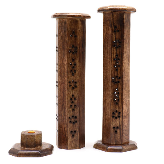 Two wooden incense holders feature intricate floral cutouts. They stand upright, with octagonal bases, on a white background, alongside a separate matching base piece.