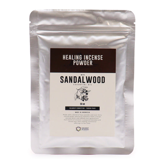 A silver package labeled "Healing Incense Powder with Sandalwood Essential Oil." Text describes calming properties, made in Indonesia. Image includes a drawing of sandalwood leaves and mentions Ancient Wisdom.