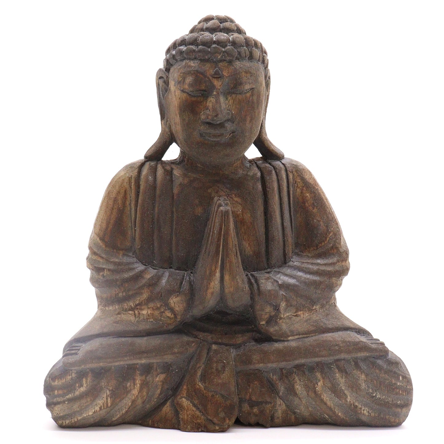 A wooden Buddha statue is seated in a meditative pose with hands pressed together in prayer, placed against a plain white background.