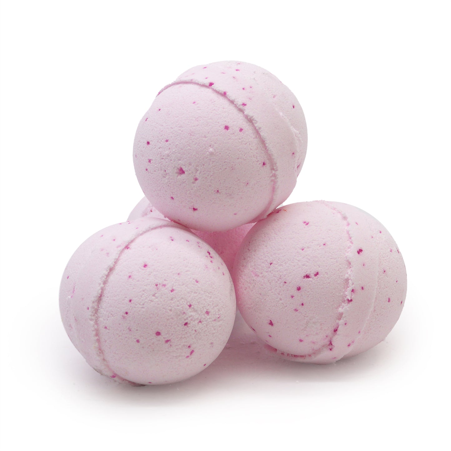 Four pink bath bombs with speckled surfaces are stacked together on a clean white background.