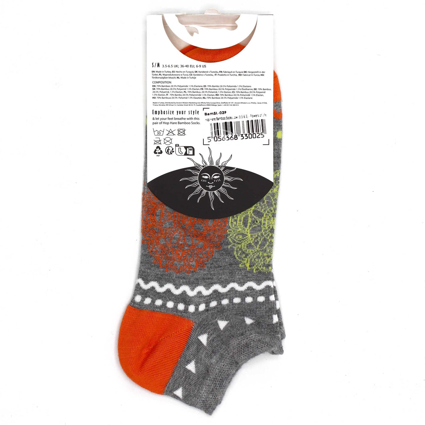 A pair of grey and orange ankle socks with patterned designs is shown on its packaging. The socks are made of bamboo, polyamide, and elastane. The packaging includes care instructions and size information.