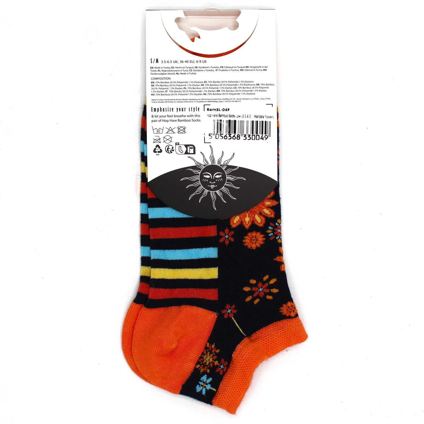 A pair of socks, displaying a striped and floral pattern, is shown on a white background with its attached tag. The tag details materials (70% bamboo, 28.5% polyamide, 1.5% elastane), size (S/M), and washing instructions. The text on the tag also states “Hop Hare Bamboo Socks Low (3.5-6.5) Mandala Flowers”.