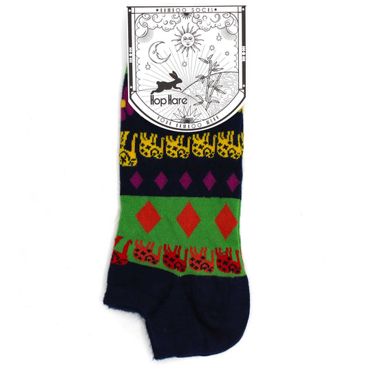 A colorful, patterned sock, featuring a repeating design of animals and geometric shapes, is displayed against a white background. The attached tag reads: *BAMBOO SOCKS* Hop Hare YOUR BAMBOO WEAR.