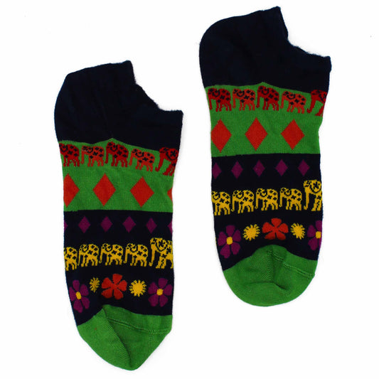 Two ankle socks lie on a white background. They are dark blue, green, and feature a pattern of elephants and flowers.