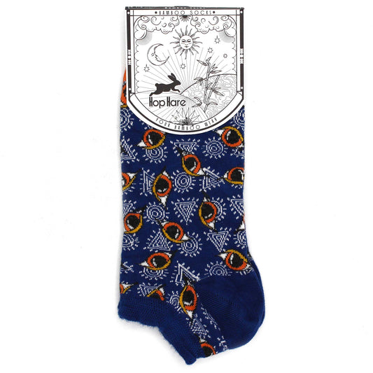 A blue sock with an eye pattern sits on a white background. The sock has a tag that reads "*BAMBOO SOCKS*", "Hop Hare", "YOUR BAMBOO WEAR".