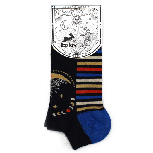 Bamboo socks with celestial and striped patterns are displayed on a white background. The attached tag reads "*BAMBOO SOCKS*", "Hop Hare", "YOUR BAMBOO WEAR".