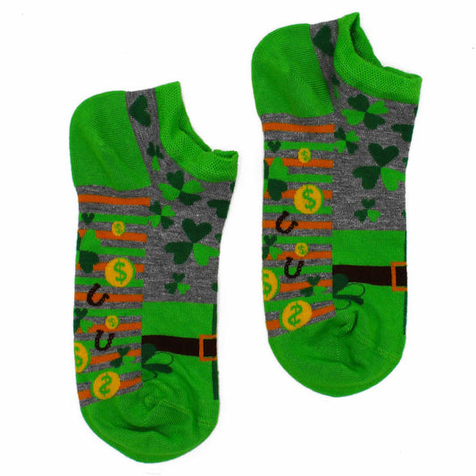 A pair of green and grey socks, featuring shamrocks, coins, and horseshoes, rest on a white background.