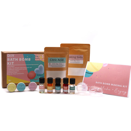 Bath bomb making kit includes bags of citric acid and baking soda, small bottles of colorful dyes and scents, molds, and instruction card. Packaging features playful, colorful design.
