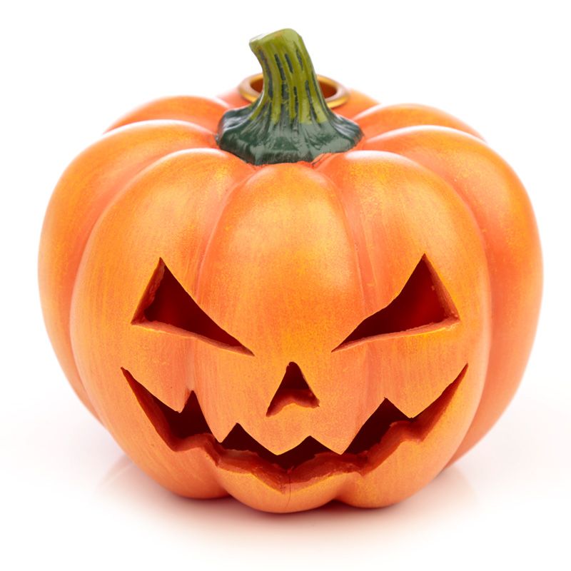 A carved orange pumpkin displays a menacing, triangular-eyed face with a jagged mouth, set on a white background.