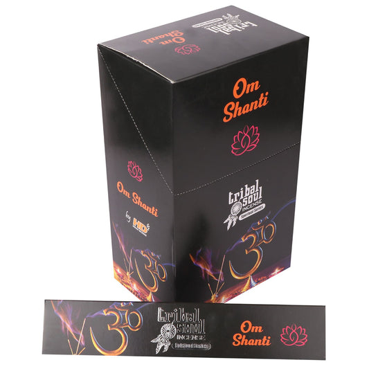 A black box features colorful "Om Shanti" text, a lotus icon, and "Tribal Soul Incense" branding. It includes fiery "Om" symbols. The box is from the "Shamanic Series" by H. D.