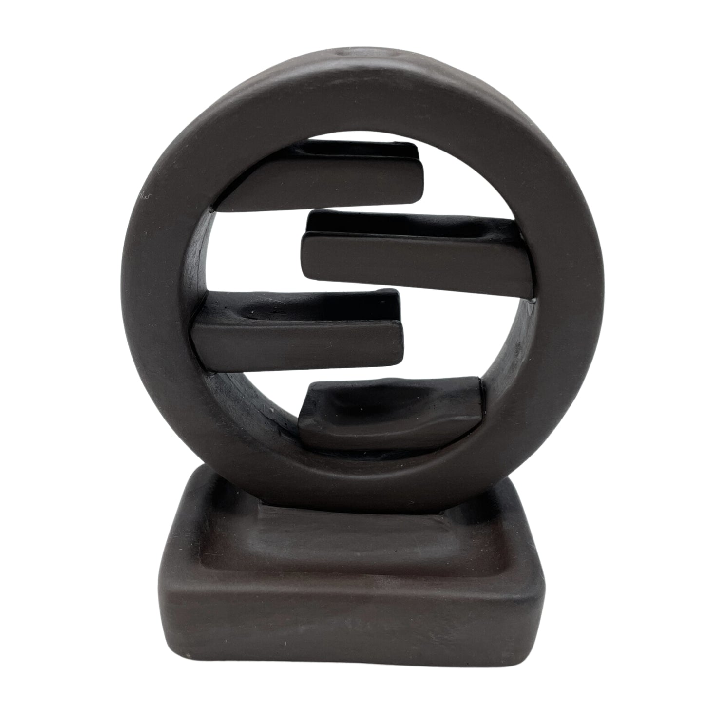 A dark brown ceramic sculpture features an abstract circle with three horizontal bars inside, resting on a square base, against a plain white background.