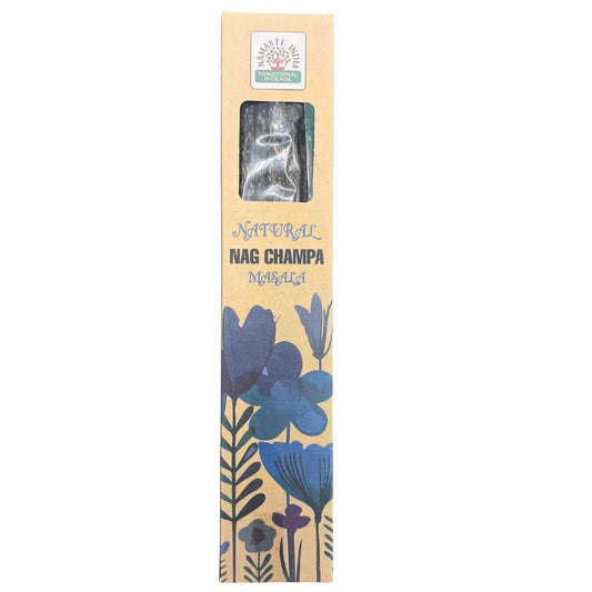 Incense box displaying "NATURAL NAG CHAMPA MASALA" with floral design. Label reads "NAMASTE INDIA TRADITIONAL INCENSE." A clear window reveals contents inside, set against a neutral background.