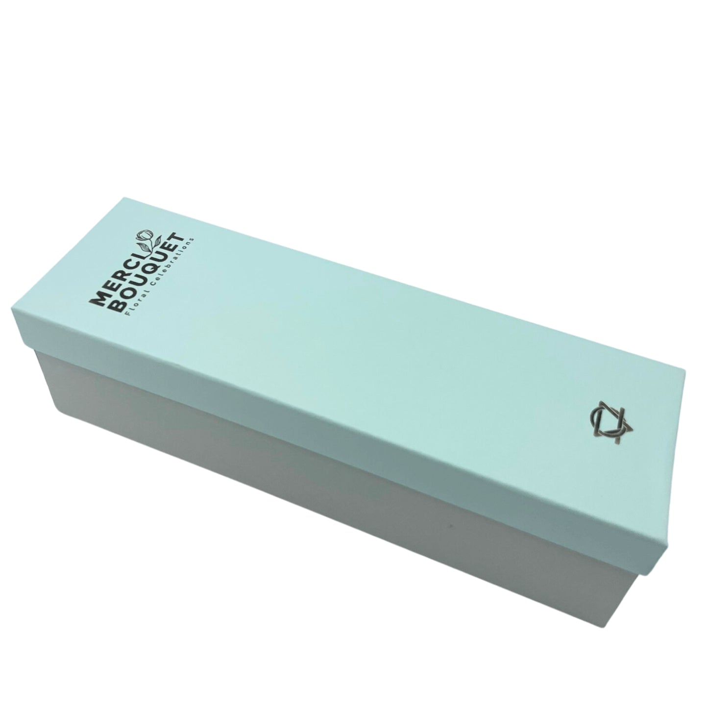 A light-blue rectangular box sits on a white background. The box displays "MERCI BOUQUET Floral Celebrations" and a small logo.