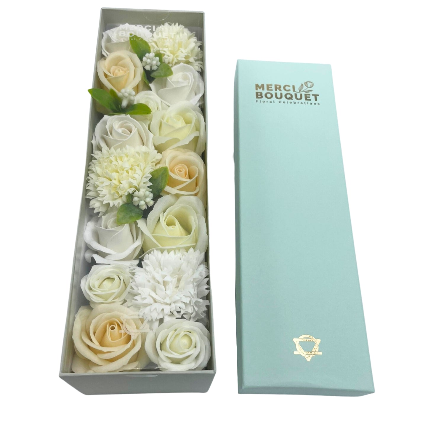 Soap roses and carnations, arranged in a gray box, are presented alongside a light-blue box. The light-blue box says, “MERCI BOUQUET Floral Celebrations”.