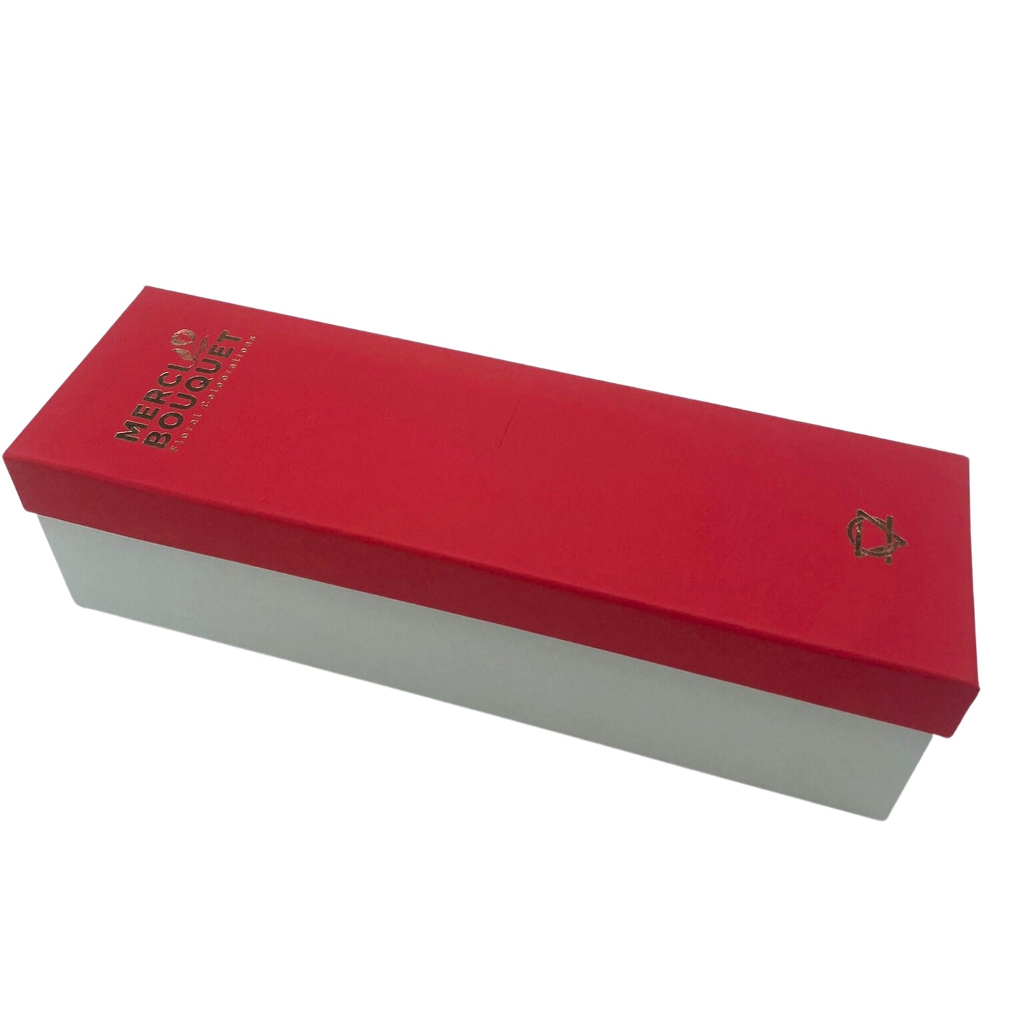 A red and white box rests on a white background. The red lid displays "MERCI BOUQUET Floral Creations" in gold lettering.