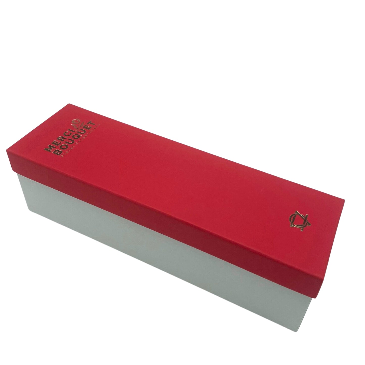 A red and white box sits on a white background. The top is red with gold lettering: "MERCI BOUQUET FLORAL GIFTS" and a gold logo.