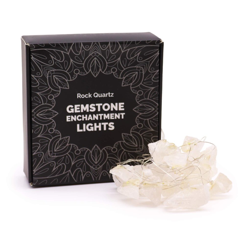 Rock quartz gemstone enchantment lights sit next to a box with a black patterned background with the words “Rock Quartz GEMSTONE ENCHANTMENT LIGHTS” displayed on the front.