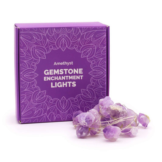 A purple box labeled "Amethyst GEMSTONE ENCHANTMENT LIGHTS" sits next to a tangle of illuminated amethyst gemstones against a white background.