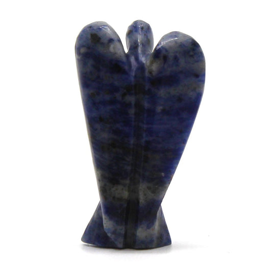 A stone angel, carved with flowing wings, stands upright. It is navy blue with grey specks and is on a plain, white surface.