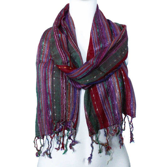 A striped scarf, tied around a mannequin's neck, displays maroon, green, purple, and gold threads.
