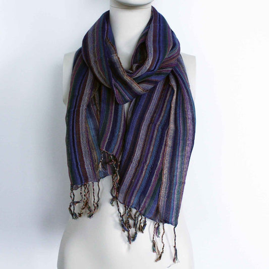 A striped scarf, draped around a mannequin's neck, is displayed against a white background.