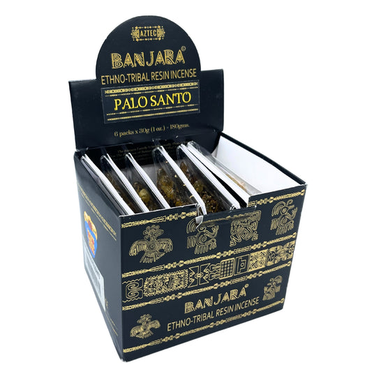 Box containing resin incense packs labeled "BANJARA Ethno-Tribal Resin Incense Palo Santo." Displaying decorative Aztec motifs and text: "6 packs x 30g (1 oz.) = 180gms."