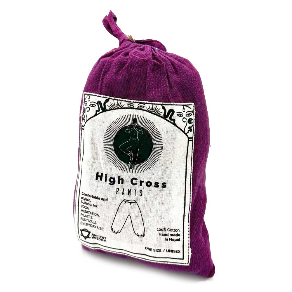 A purple cloth bag contains high-cross pants; the label indicates they are comfortable, stylish, and suitable for yoga, meditation, pilates, festivals, and everyday use; they are 100% cotton, handmade in Nepal, one size, and unisex.