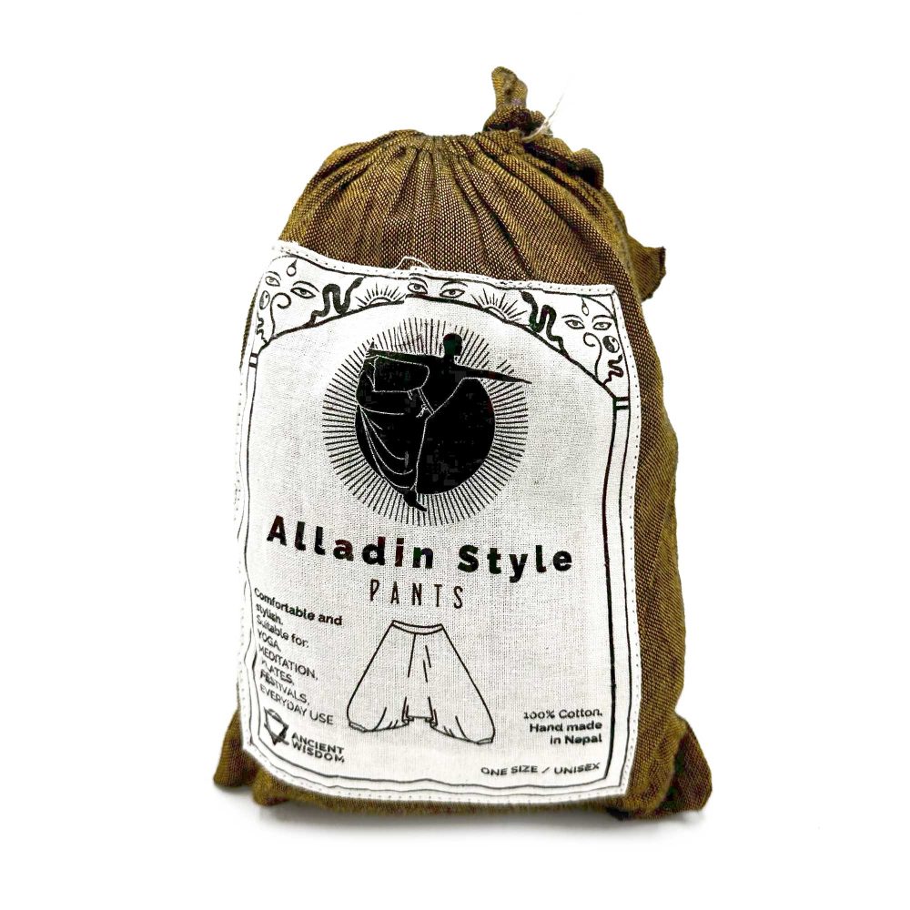 A pair of Aladdin-style pants, contained within a drawstring bag, are presented. The bag's label depicts a figure wearing the pants and indicates they are 100% cotton, handmade in Nepal, and one size fits all/unisex.