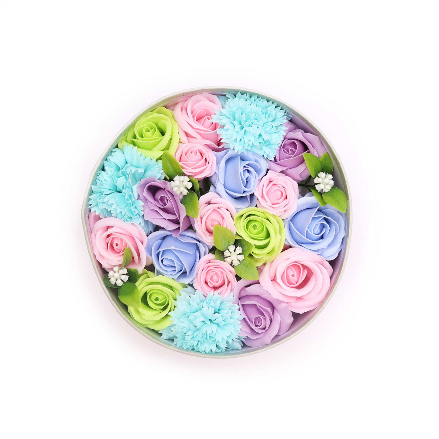 Pastel soap roses and carnations are arranged in a round box. The flowers are densely packed, creating a full and colorful display against a white background.