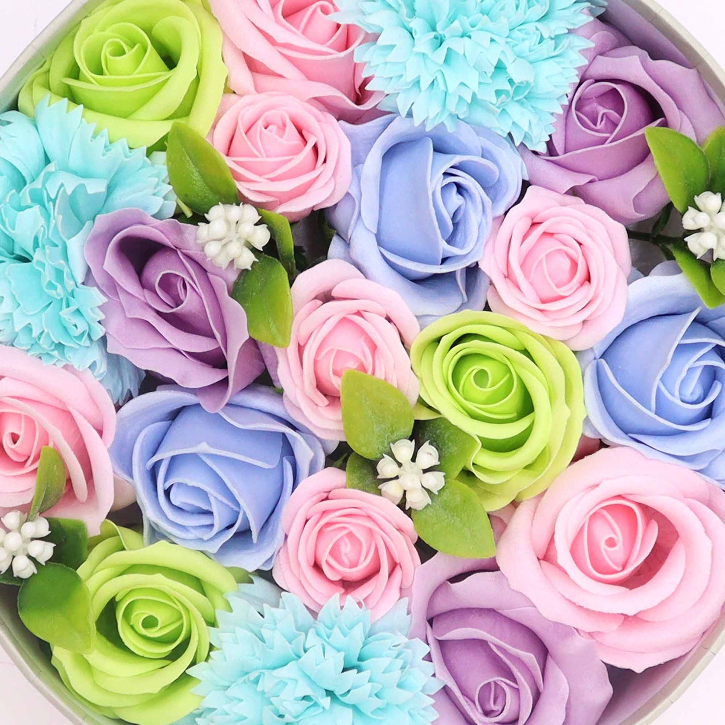 Pastel-colored soap roses and carnations are arranged in a circular box.