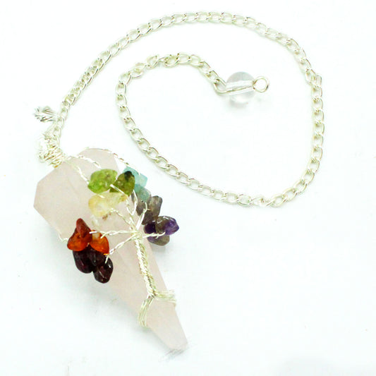 A light pink crystal pendulum hangs with a silver chain on a white background. Colorful gemstones arranged like leaves accent the crystal.