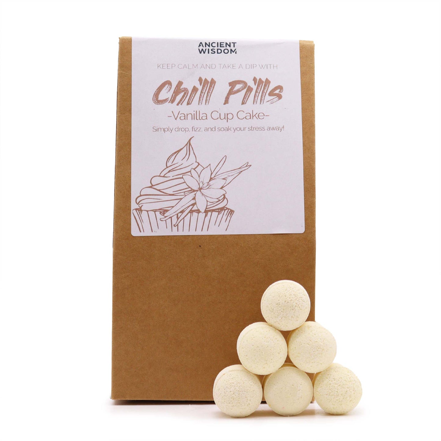 Brown paper package labeled "Ancient Wisdom Chill Pills - Vanilla Cup Cake" is displayed with six white, spherical bath bombs stacked in a pyramid. Illustration of a cupcake decorates the label.