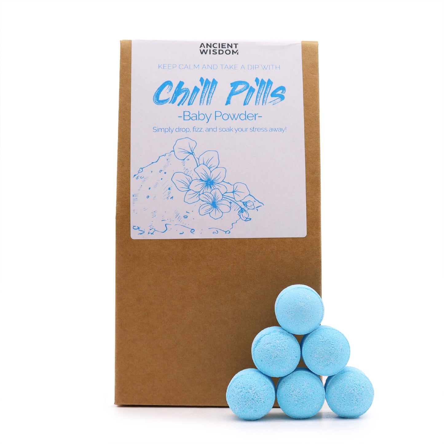 A brown package displays a label reading "ANCIENT WISDOM: Chill Pills - Baby Powder." Six blue bath bombs are stacked nearby, suggesting relaxation. Illustrated flowers adorn the label.