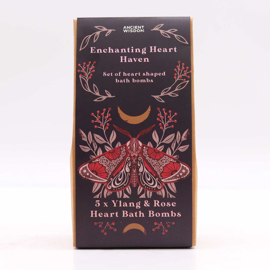 A decorative box displays a red moth illustration with floral accents. Text reads: "ANCIENT WISDOM Enchanting Heart Haven Set of heart-shaped bath bombs 5 x Ylang & Rose Heart Bath Bombs."