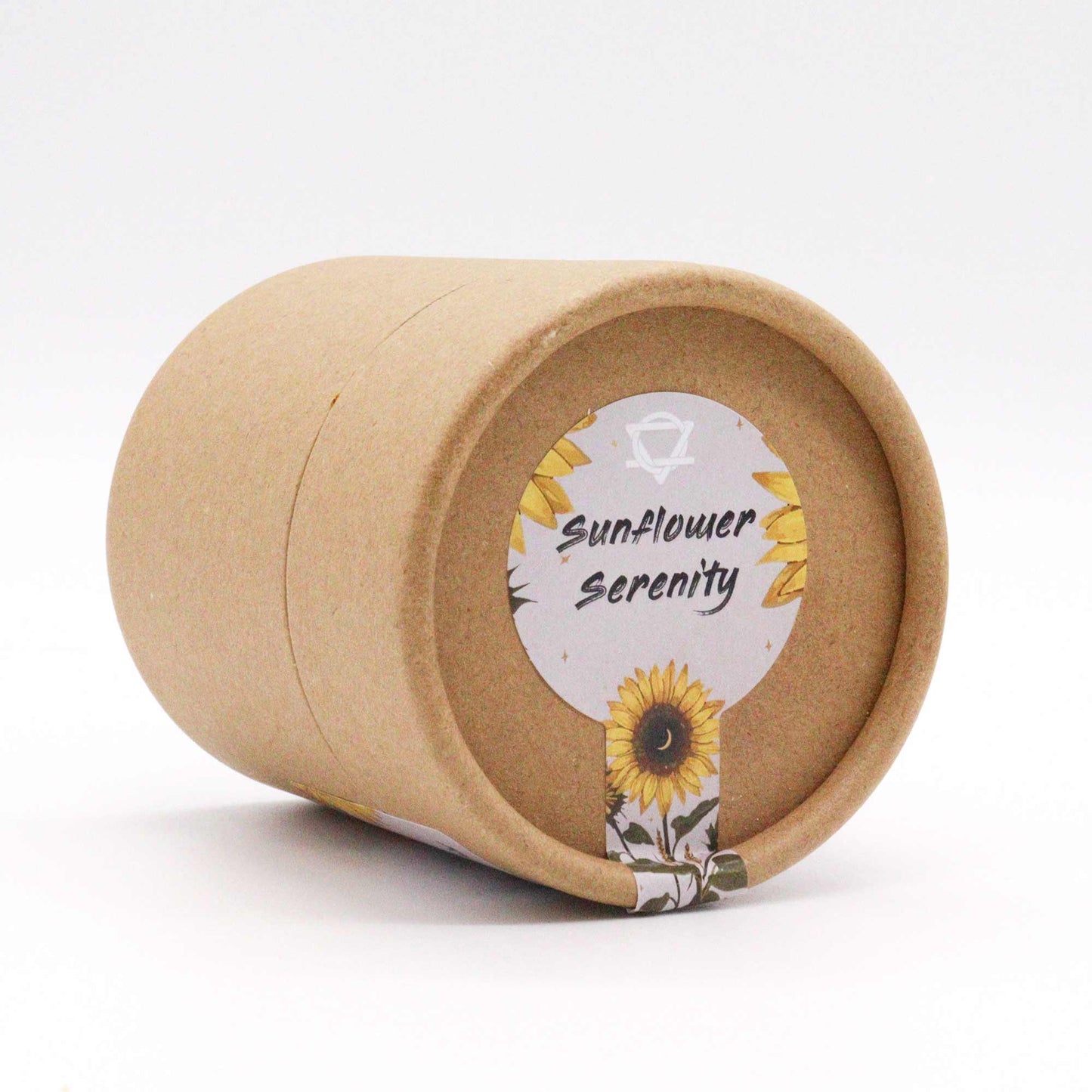 A cylindrical brown cardboard container lies on its side. The lid features a circular label with sunflowers, reading "Sunflower Serenity," against a plain, light background.