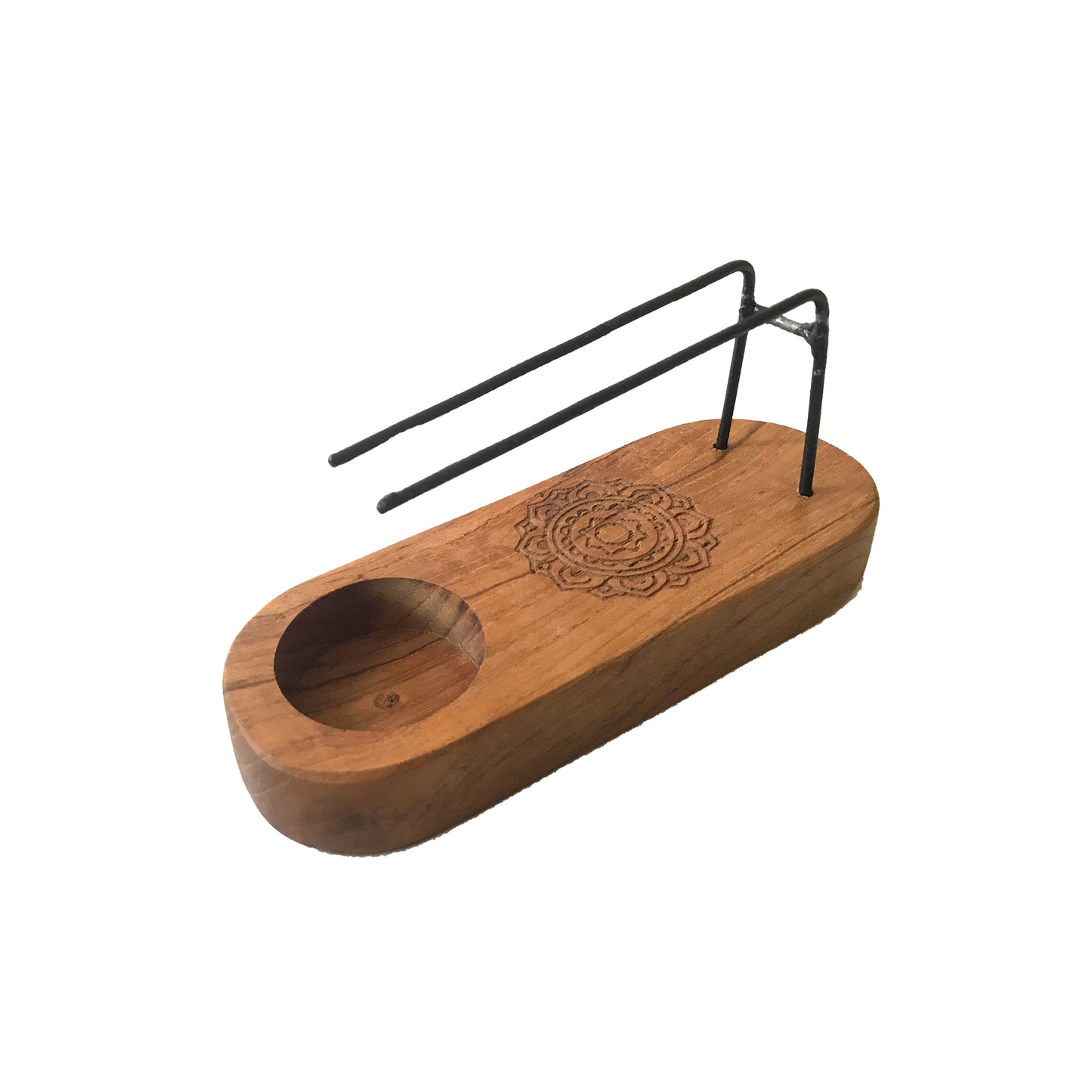 A wooden incense holder, featuring a small depression and a wire incense stick rest, sits on a plain white background.