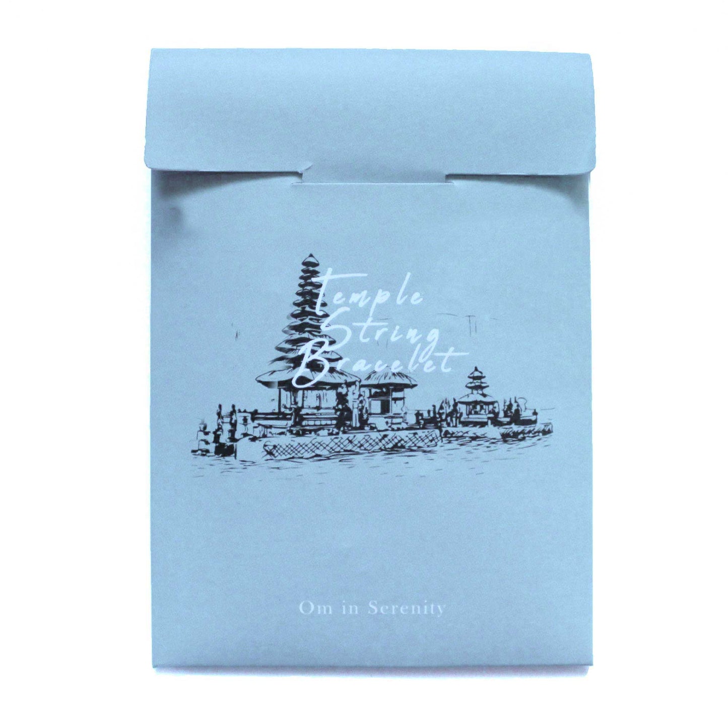 A blue packet features a detailed sketch of a temple above water along with the text “Temple String Bracelet” and "Om in Serenity."