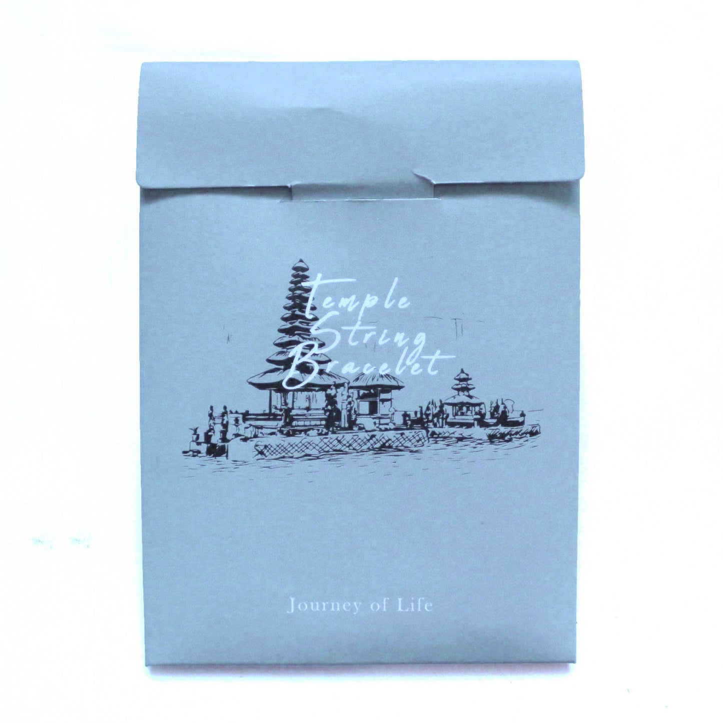 The light blue envelope features a black sketch of a temple scene; the words "Temple String Bracelet" are written in script over the temple. The text "Journey of Life" is at the bottom.