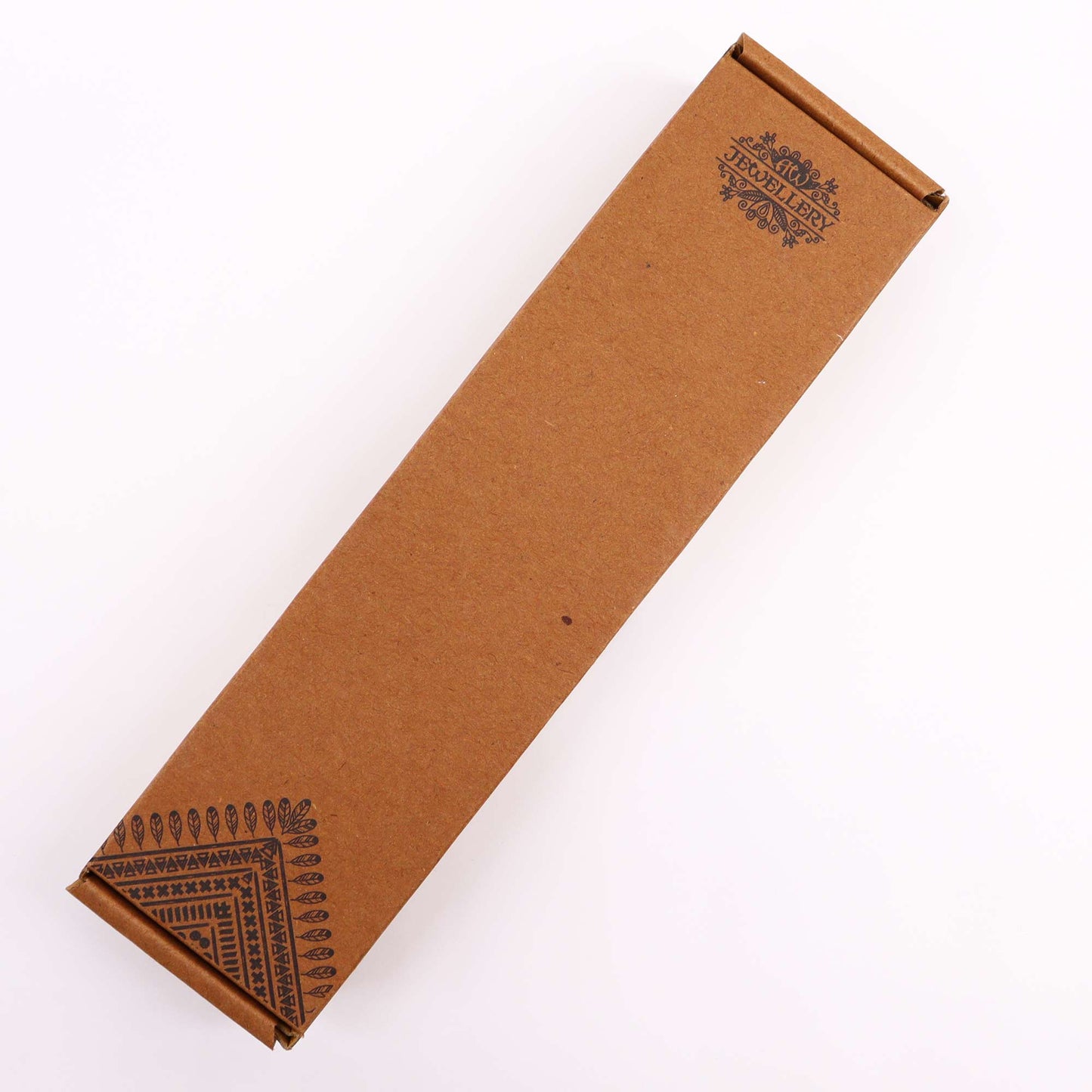 A brown rectangular box with "AGW JEWELLERY" and patterns printed on the sides sits closed on a white surface.