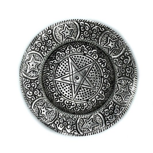 An ornate silver-colored circular plate features a central pentagram, surrounded by intricate swirling patterns and additional star motifs, against a plain white background.