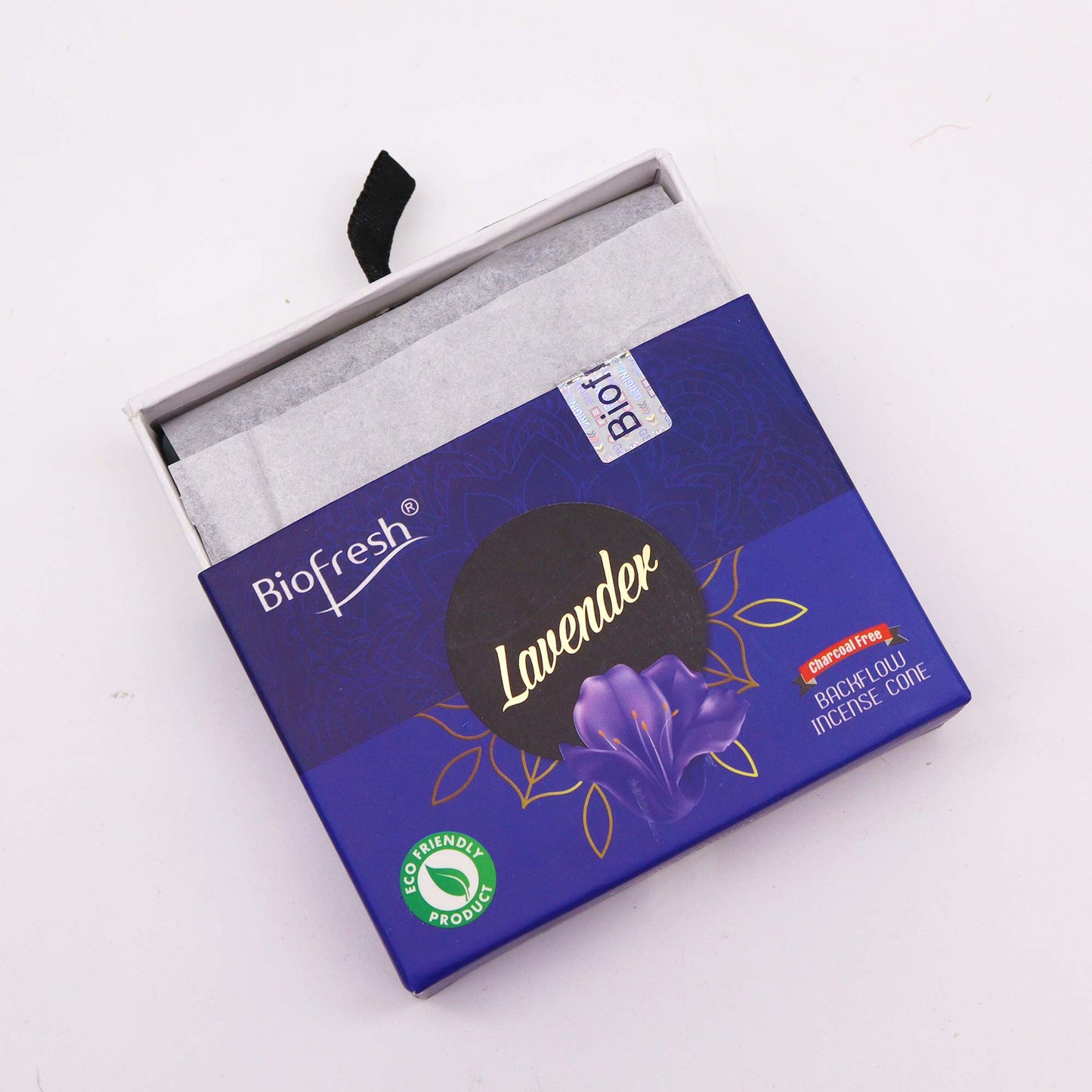 A lavender-scented BioFresh backflow incense cone box sits open on a white surface. The box is purple, and displays the text "BioFresh", "Lavender", "Charcoal Free", "Backflow Incense Cone", and "Eco Friendly Product".
